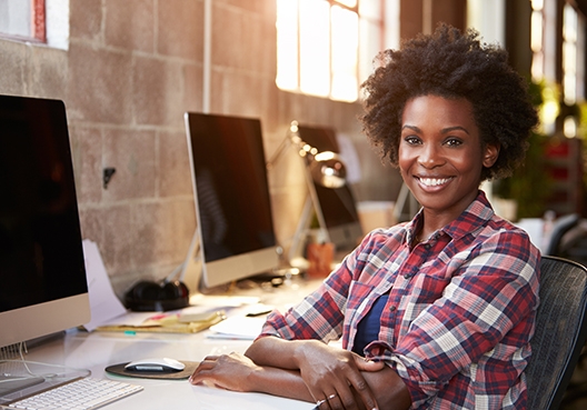 woman sitting at her desk