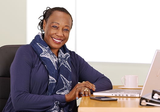 woman sitting at her desk