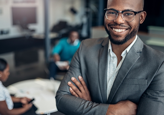 man standing with his arms crossed