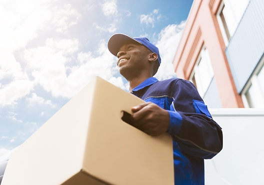 worker carrying a parcel